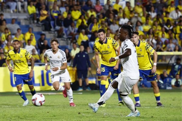 Vinicius Junior scores their first goal from the penalty spot