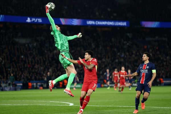 Gianluigi Donnarumma claims the ball under pressure from Luis Diaz