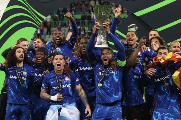 Chelsea Reece James lifts the trophy with teammates