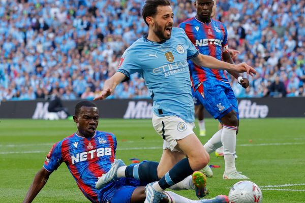 Penalty! Man City Bernardo Silva is fouled by Tyrick Mitchell
