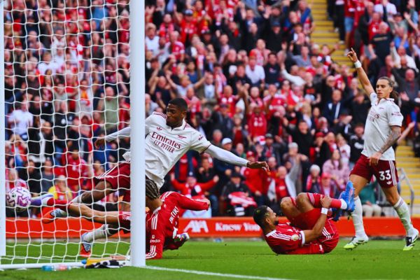 Hugo Ekitike of Liverpool bundles the ball home