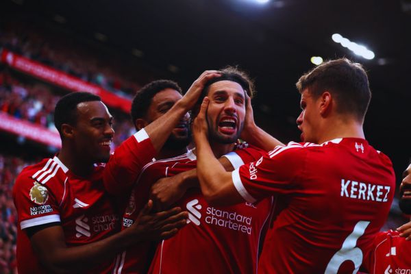 Szoboszlai celebrates with Milos Kerkez, Joe Gomez and Ryan Gravenberch
