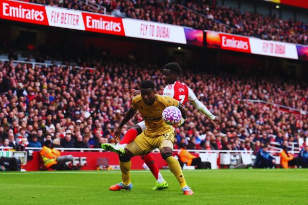 Crystal Palace’s Marc Guéhi holds off Bukayo Saka